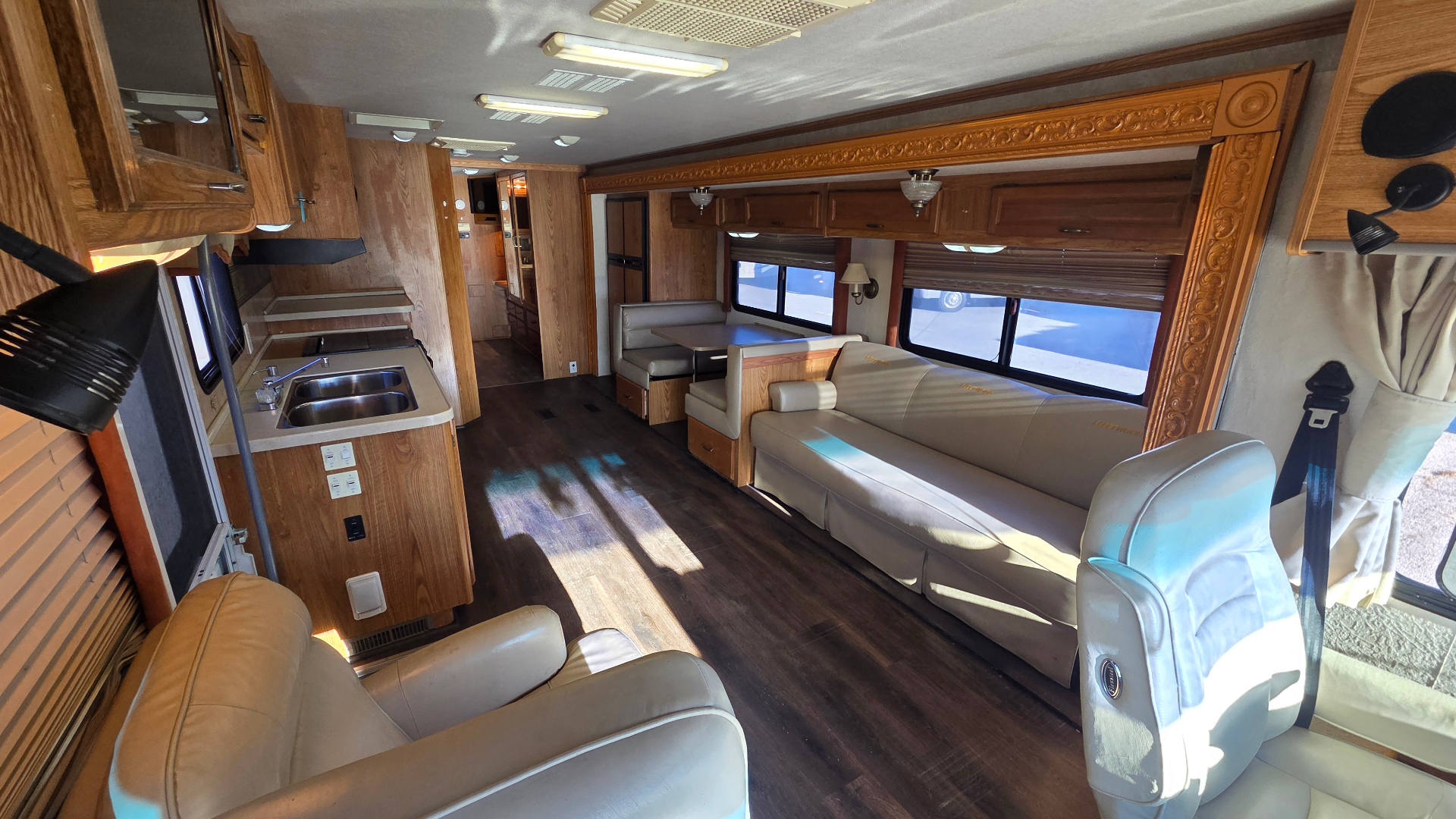 2005 Fleetwood Bounder 35E — living room with sofa, dinette and kitchen