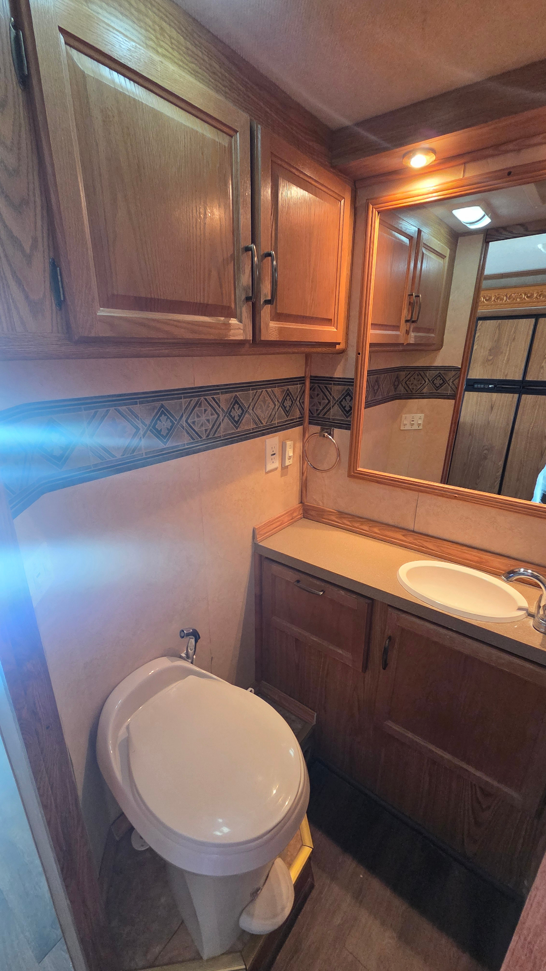 2005 Fleetwood Bounder 35E — split-bath vanity and toilet area
